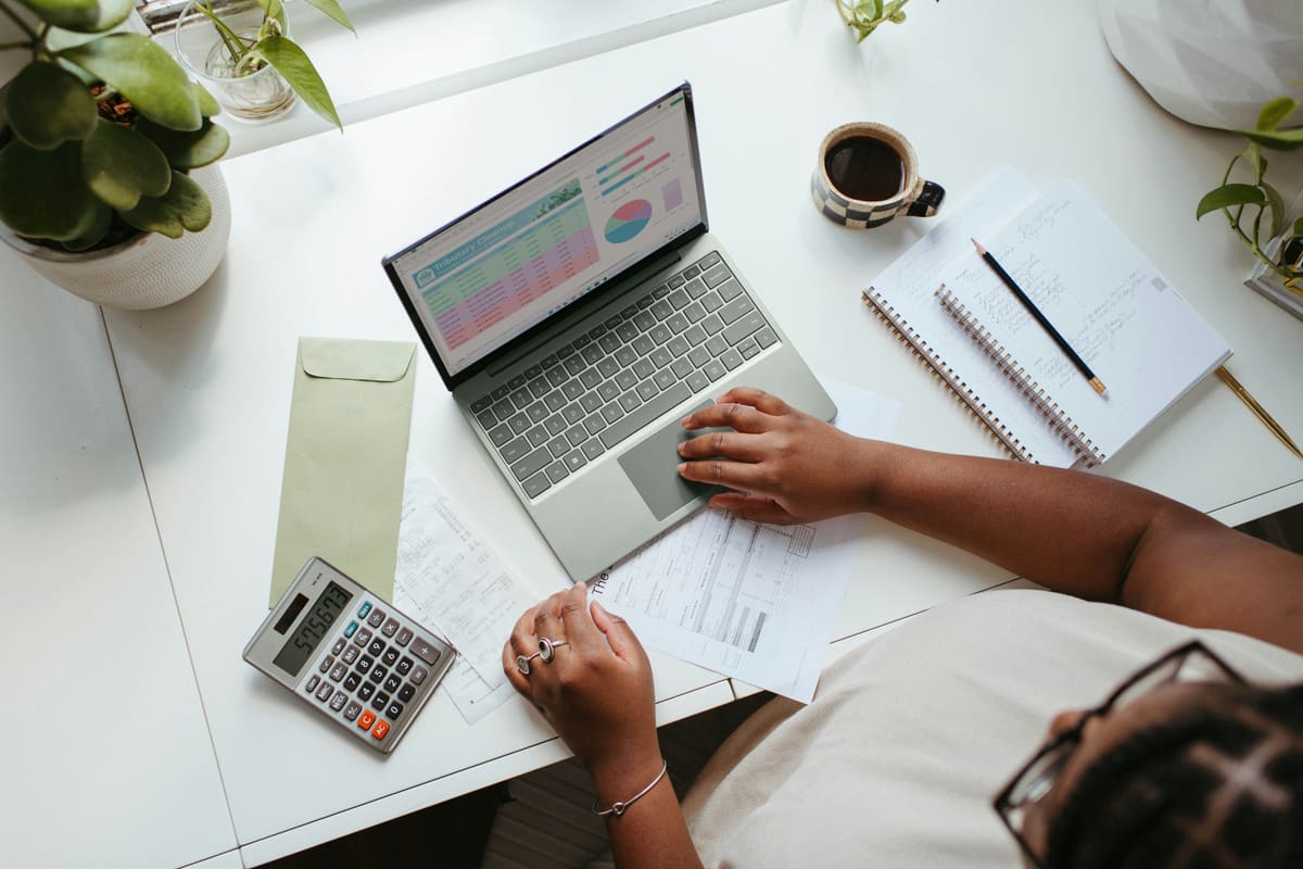 Business owner reviewing site performance and analytics on a laptop